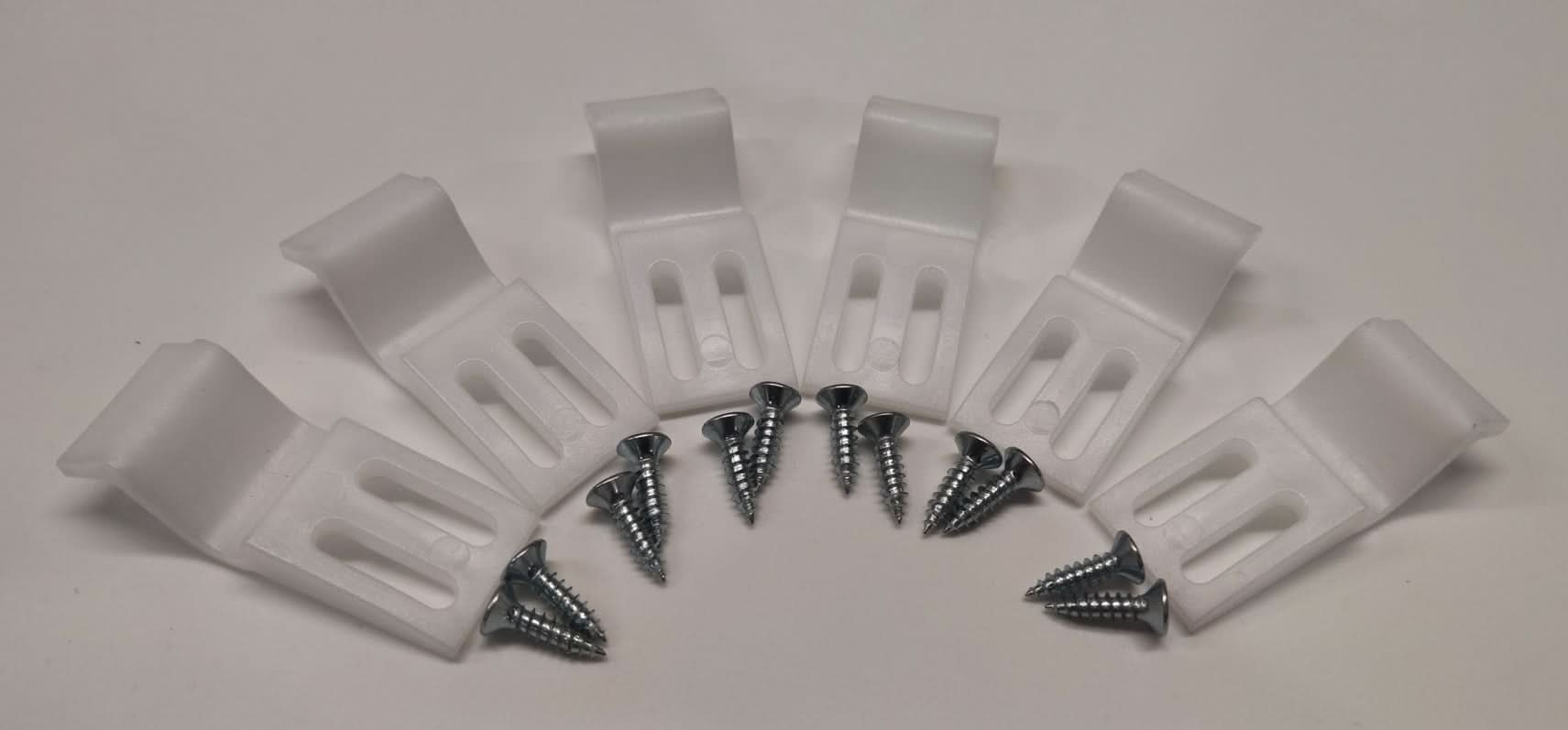 Six Nuie Shower Bath Panel Clips in white, each paired with a silver screw, are displayed in a semicircle on a white background—perfect for securing acrylic bath panels and completing your essential Nuie bathroom accessories.